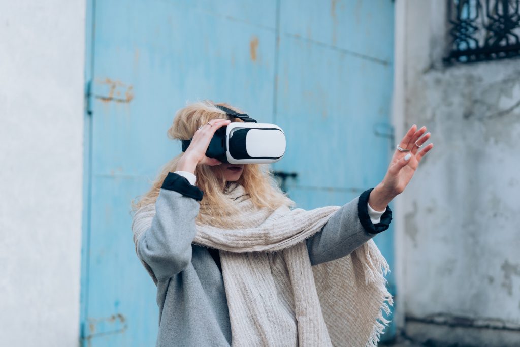 Girl in the street with a vr glasses